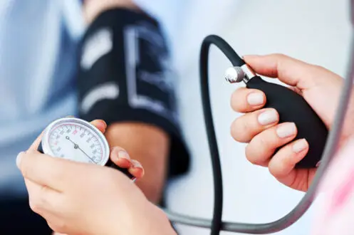 blood pressure causes and checking by a nurse